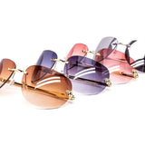 12 Pack: Oversized Rimless Feline Crest Wholesale Fashion Sunglasses